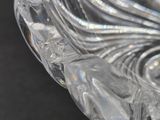 a clear glass bowl with a decorative design on it