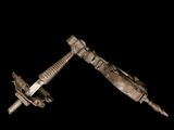 pair of old metal screws on a black background with a black background