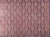 a red and black rug with a pattern on it