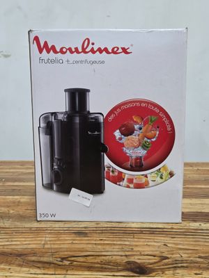 a box of food processor sitting on top of a wooden table