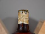a bottle of wine that is sitting on a table