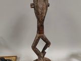 an image of a statue of a person with a knife and a picture frame