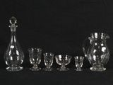 a lot of glass items that are sitting on a table