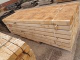 several stacks of wooden planks stacked on top of each other