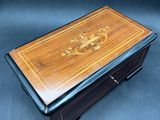 a wooden box with a design on the inside of it