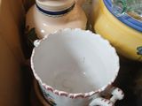 a box full of bowls and containers on a table