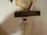 a knife that is laying on top of a piece of paper