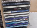 a stack of cd ' s sitting on top of a table