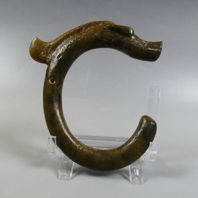 a sculpture of a snake made out of a piece of wood
