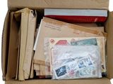 a cardboard box filled with many different types of mail
