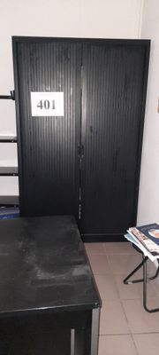 a small room with a bed and a desk