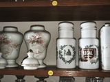 many vases and jars on a shelf in a room