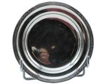 a close up of a silver plate with a reflection of a person in it