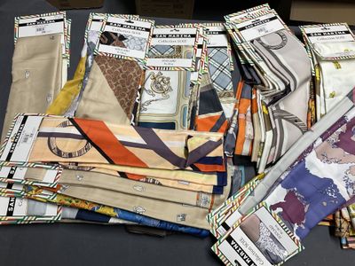many different types of ties laid out on a table