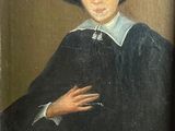 portrait d'un homme portant un chapeau noir et un manteau noir