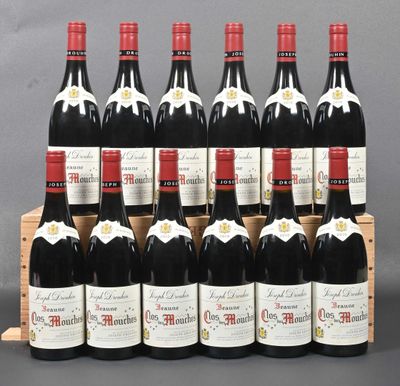 six bottles of red wine are lined up in a wooden crate