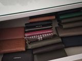 a picture of a closet with a lot of folded clothes