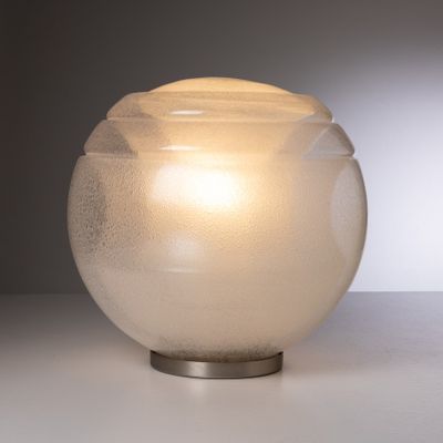 a glass vase that is sitting on a table
