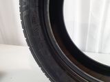 a close up of a tire on a white surface