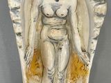 an image of a statue of a woman in a shell