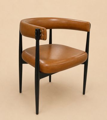 an image of a brown leather chair on a beige background