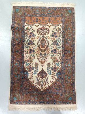 an antique persian rug with a floral design on a white background