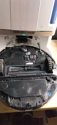 a black robot that is sitting on a table