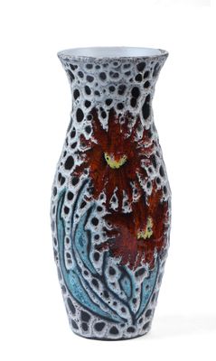 a vase with a red flower in it on a white surface