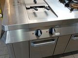 a kitchen with a stove and a sink in it