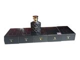 black perfume bottles on a shelf with a white background