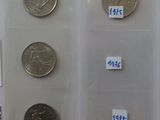 a lot of coins that are on display in a case
