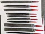 a lot of knives that are sitting on a table