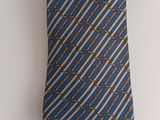blue and gold striped necktie with chain links on it