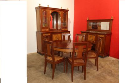 a dining room with a table and chairs and a china cabinet