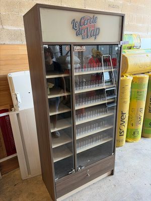 a refrigerator that has a lot of bottles in it