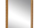 an image of a mirror with a gold frame and a floral design on it