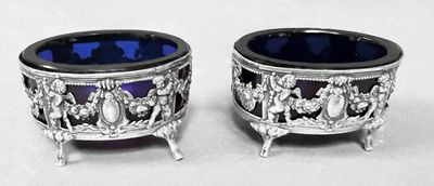 pair of silver and blue glass bowls on stand