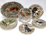 many plates with different designs of animals on them
