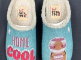 pair of blue slippers with a picture of a teddy bear and a donut on them