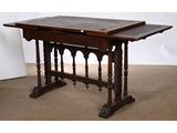 an antique table with a marble top and wooden legs