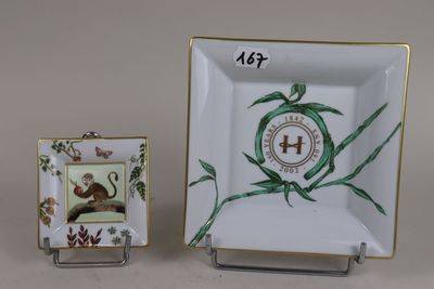 a small plate with a picture of a mouse on it and a small plate with a picture of a mouse on it