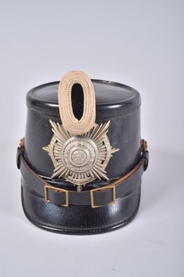 a black hat with a gold badge on it
