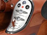 the interior of a sports car with a steering wheel and dashboard