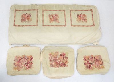 four pieces of cloth with flowers on them on a table