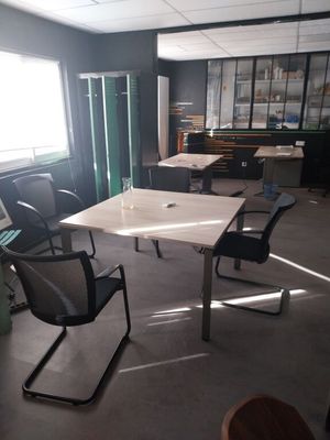 a room with a table and chairs in it