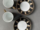 three cups and saucers are sitting on a table