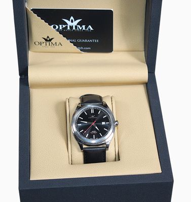 une photo d'une montre noire dans un écrin, avec un bracelet noir
