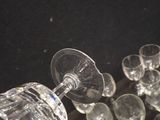 many empty wine glasses sitting on a table