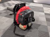 an image of a small blower on a checkered floor