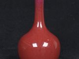 an image of a red vase on a black background